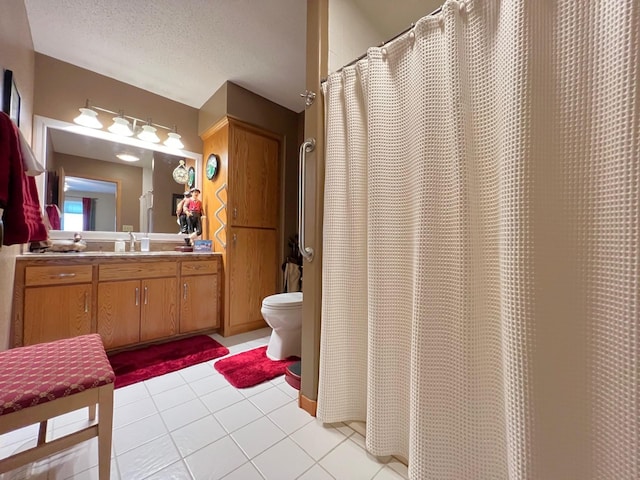 102 Mayfair Ave, New London, MN 56273 - full bathroom featuring vanity, tile patterned floors, a textured ceiling, and a shower with curtain