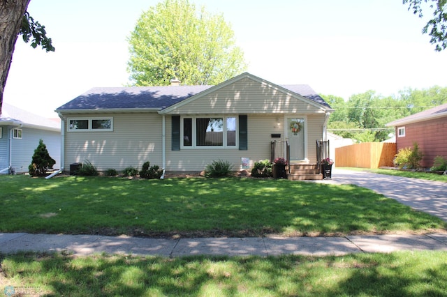 509 24th Ave N, Fargo, ND 58102 - view of front of property featuring a chimney and a shingled roof