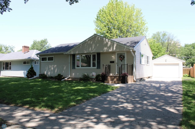509 24th Ave N, Fargo, ND 58102 - single story home featuring an outdoor structure, a detached garage, a shingled roof, and a front yard
