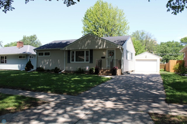 509 24th Ave N, Fargo, ND 58102 - view of front of home with an outbuilding, a detached garage, and roof with shingles