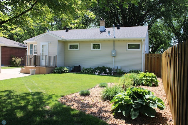 509 24th Ave N, Fargo, ND 58102 - rear view of house featuring a chimney and a shingled roof
