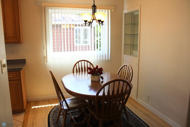 509 24th Ave N, Fargo, ND 58102 - dining room with light wood-style flooring and a chandelier