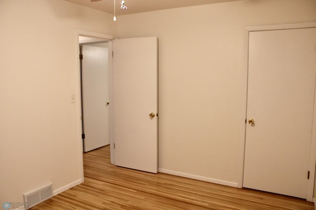 509 24th Ave N, Fargo, ND 58102 - unfurnished bedroom with light wood-type flooring and baseboards