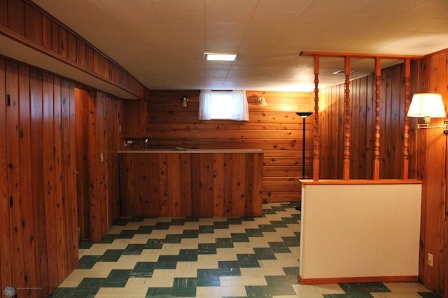 509 24th Ave N, Fargo, ND 58102 - below grade area featuring wooden walls and tile patterned floors