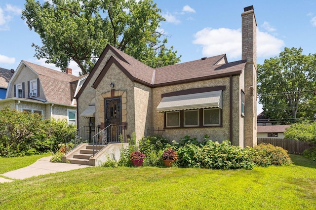 3609 Elliot Ave, Minneapolis, MN 55407 - view of front of house featuring a chimney, stucco siding, and a shingled roof
