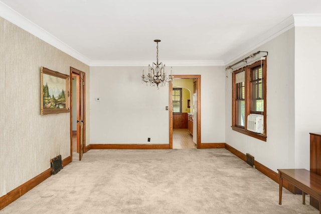 3609 Elliot Ave, Minneapolis, MN 55407 - unfurnished room featuring ornamental molding, light colored carpet, a chandelier, arched walkways, and cooling unit
