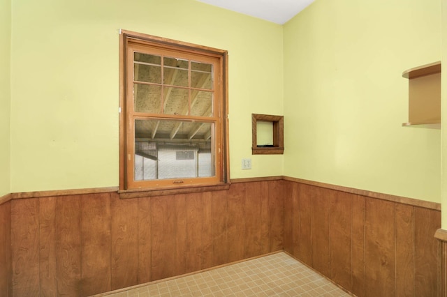 3609 Elliot Ave, Minneapolis, MN 55407 - spare room with wainscoting and wooden walls