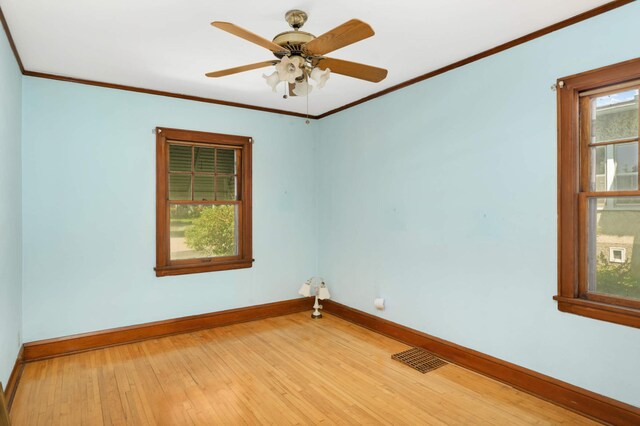 3609 Elliot Ave, Minneapolis, MN 55407 - spare room with light wood-type flooring, ornamental molding, and a ceiling fan