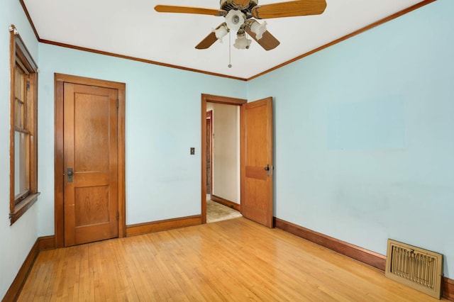 3609 Elliot Ave, Minneapolis, MN 55407 - unfurnished bedroom featuring light wood-style flooring, crown molding, and a ceiling fan