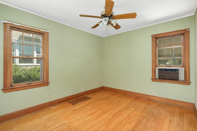 3609 Elliot Ave, Minneapolis, MN 55407 - unfurnished room featuring cooling unit, light wood-type flooring, ornamental molding, and ceiling fan
