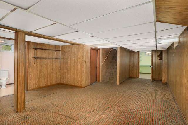 3609 Elliot Ave, Minneapolis, MN 55407 - basement with stairway, plenty of natural light, carpet, and wooden walls
