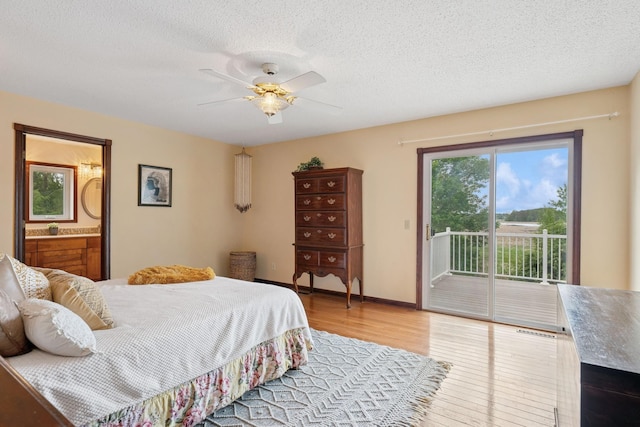 19826 Dakota Ave, Prior Lake, MN 55372 - bedroom featuring access to outside, wood finished floors, a textured ceiling, ensuite bathroom, and ceiling fan