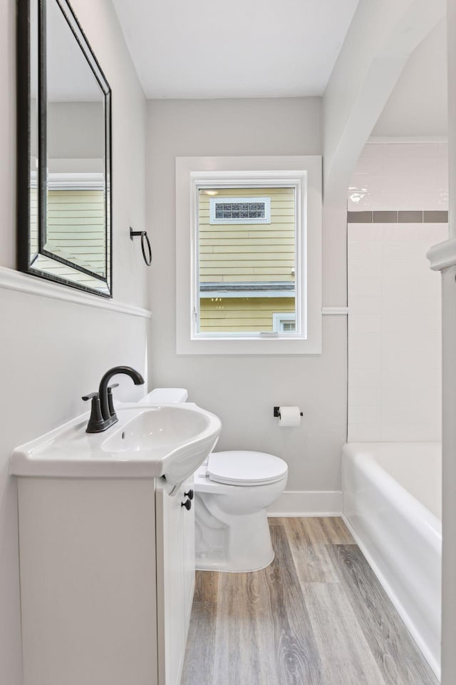 3305 Huntington Ave, Saint Louis Park, MN 55416 - bathroom with wood finished floors, vanity, and washtub / shower combination