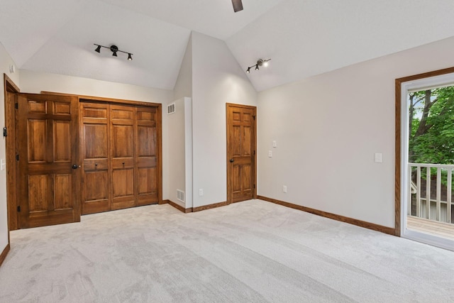 3305 Huntington Ave, Saint Louis Park, MN 55416 - unfurnished bedroom featuring vaulted ceiling, access to exterior, carpet floors, and ceiling fan