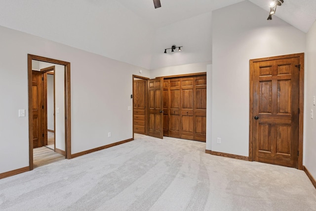 3305 Huntington Ave, Saint Louis Park, MN 55416 - unfurnished bedroom featuring carpet flooring, a closet, high vaulted ceiling, and a ceiling fan