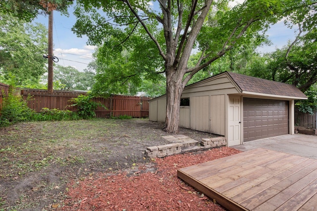 3305 Huntington Ave, Saint Louis Park, MN 55416 - fenced backyard featuring an outdoor structure and a detached garage
