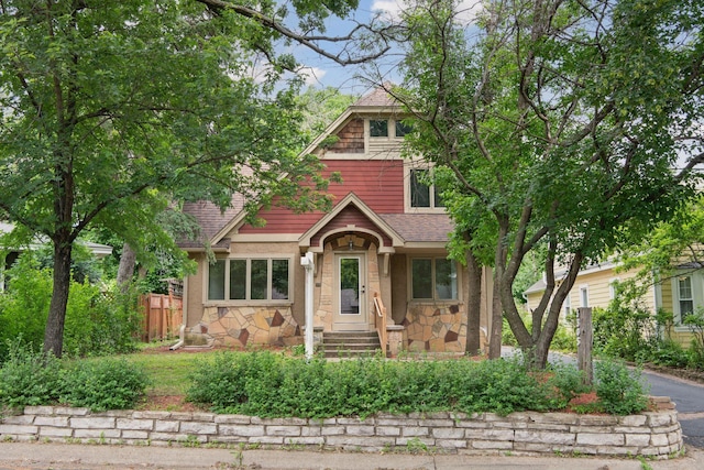 3305 Huntington Ave, Saint Louis Park, MN 55416 - view of front of home with stone siding, a shingled roof, and driveway