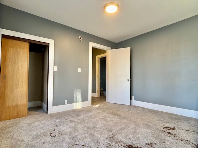 415 College St, Albert Lea, MN 56007 - unfurnished bedroom featuring carpet and a closet
