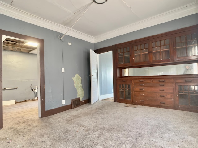 415 College St, Albert Lea, MN 56007 - unfurnished living room featuring crown molding and carpet floors