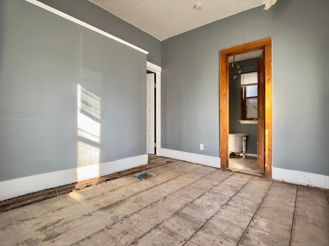 415 College St, Albert Lea, MN 56007 - empty room with baseboards