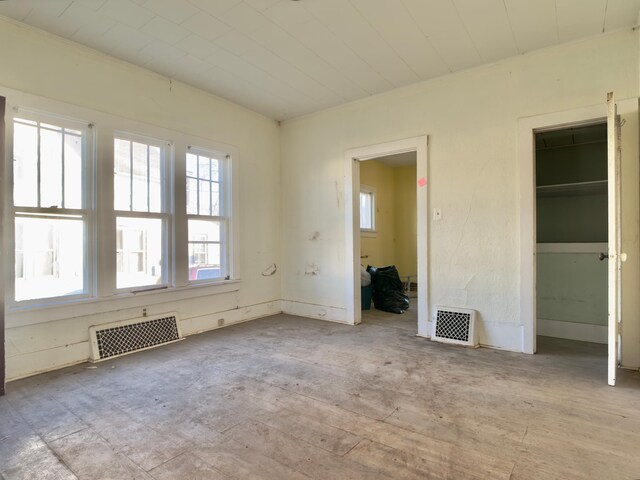 415 College St, Albert Lea, MN 56007 - unfurnished bedroom featuring multiple windows and a closet