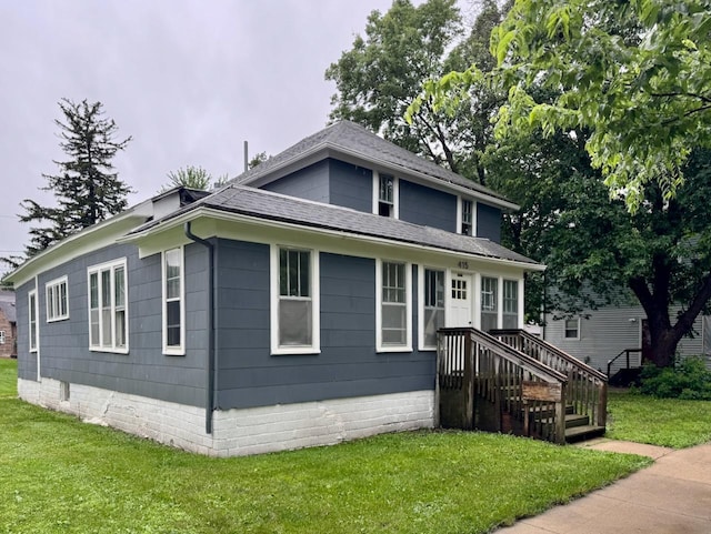 415 College St, Albert Lea, MN 56007 - view of front of home with a front lawn, crawl space, and a shingled roof