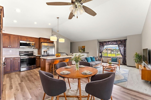 300 Dakota Ave, Roberts, WI 54023 - dining space with vaulted ceiling, light wood-style flooring, and a ceiling fan
