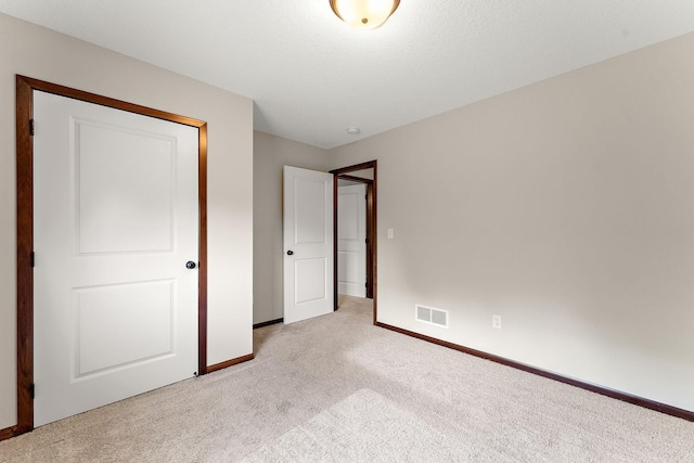 300 Dakota Ave, Roberts, WI 54023 - unfurnished bedroom with light colored carpet and baseboards