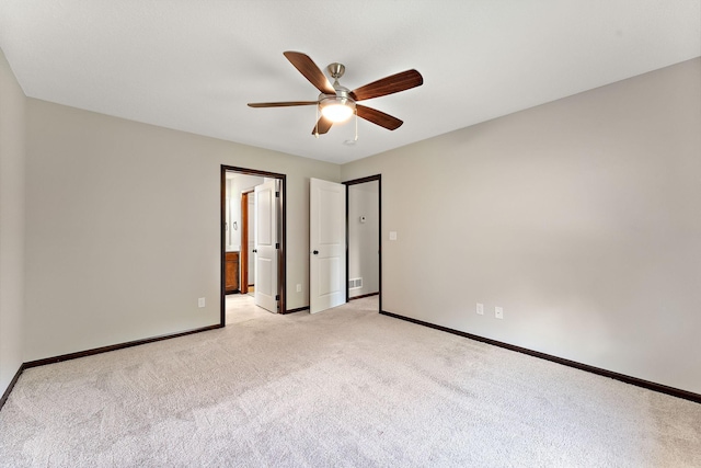 300 Dakota Ave, Roberts, WI 54023 - unfurnished bedroom with light colored carpet, ensuite bath, and a ceiling fan