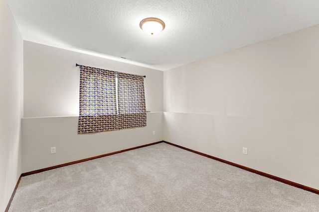 300 Dakota Ave, Roberts, WI 54023 - carpeted empty room featuring a textured ceiling and baseboards