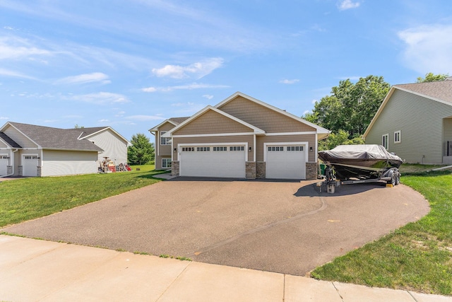 300 Dakota Ave, Roberts, WI 54023 - view of front facade with stone siding, driveway, a front yard, and a garage