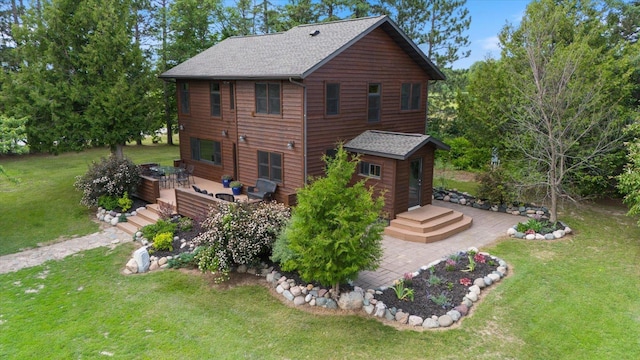 14766 Danson Rd, Splithand Twp, MN 55744 - view of front of property featuring a deck, a front yard, and roof with shingles