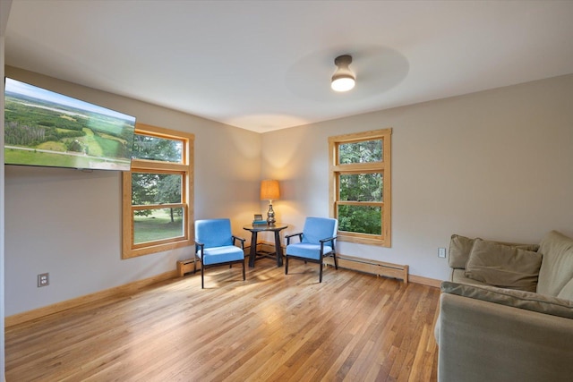 14766 Danson Rd, Splithand Twp, MN 55744 - sitting room with light wood finished floors, baseboard heating, and ceiling fan