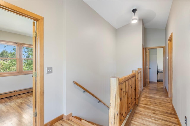 14766 Danson Rd, Splithand Twp, MN 55744 - corridor with an upstairs landing, light wood-style floors, and baseboard heating