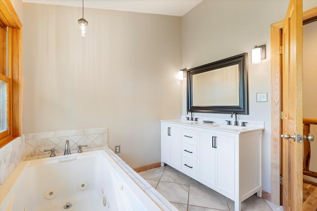 14766 Danson Rd, Splithand Twp, MN 55744 - bathroom with a tub with jets, double vanity, and tile patterned flooring