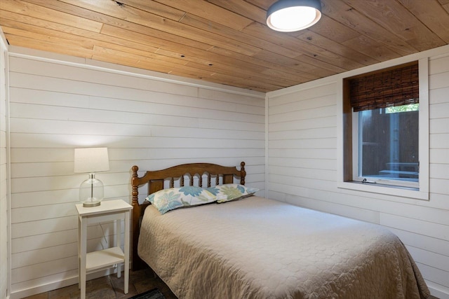 14766 Danson Rd, Splithand Twp, MN 55744 - bedroom with wooden ceiling and wood walls