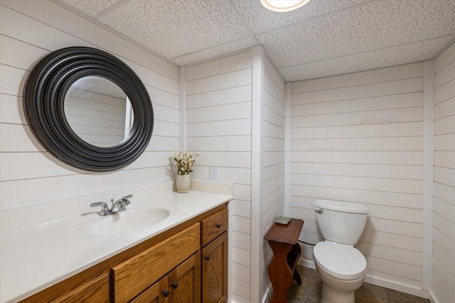 14766 Danson Rd, Splithand Twp, MN 55744 - bathroom with wood walls, vanity, and a paneled ceiling