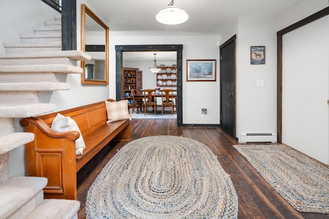 1708 Woodland Rd, Saint Cloud, MN 56304 - living area with a baseboard radiator, wood finished floors, and stairway