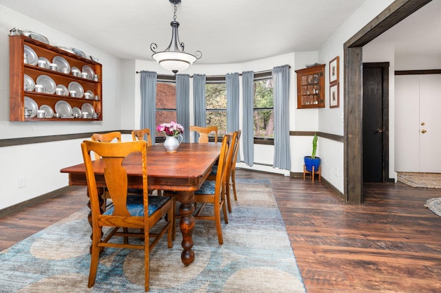 1708 Woodland Rd, Saint Cloud, MN 56304 - dining room with wood finished floors and a baseboard heating unit