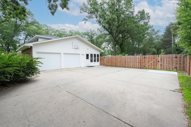 1708 Woodland Rd, Saint Cloud, MN 56304 - view of property exterior featuring concrete driveway and a garage