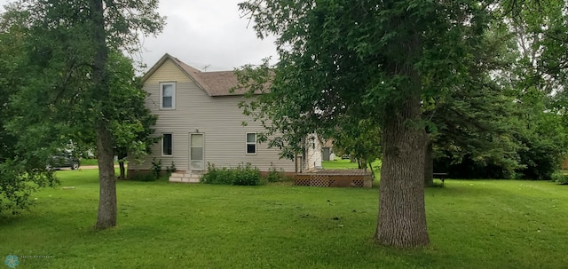 103 Main St S, Kindred, ND 58052 - view of side of home featuring a lawn and a shingled roof