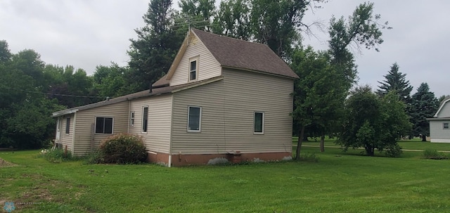 103 Main St S, Kindred, ND 58052 - view of side of home featuring a yard and roof with shingles