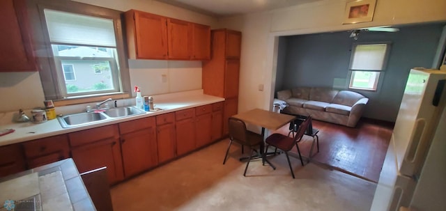 103 Main St S, Kindred, ND 58052 - kitchen featuring brown cabinets, light countertops, and open floor plan