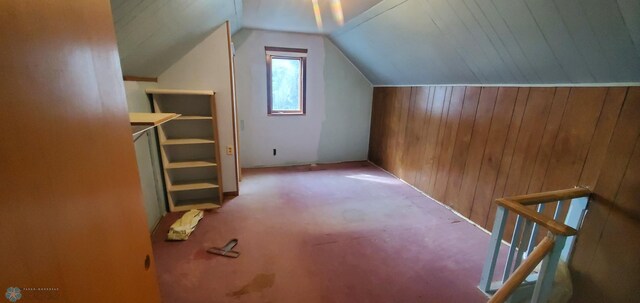 103 Main St S, Kindred, ND 58052 - additional living space featuring lofted ceiling, wooden walls, and carpet flooring