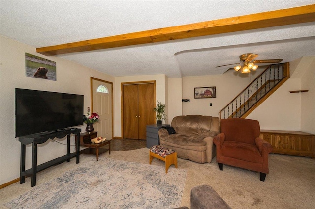 3732 6th St, Superior, WI 54880 - carpeted living room with beamed ceiling, stairs, ceiling fan, and a textured ceiling
