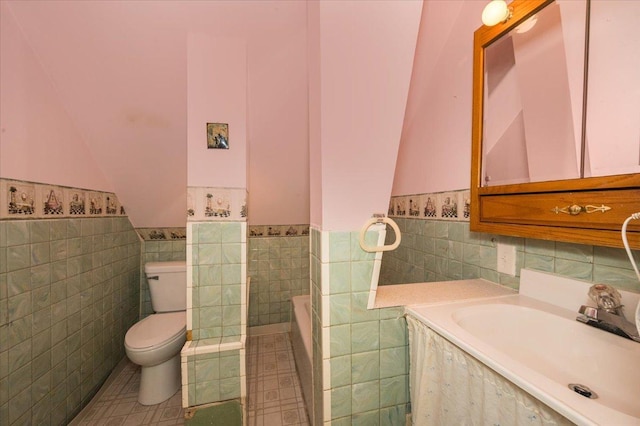3732 6th St, Superior, WI 54880 - full bathroom with tile walls, a relaxing tiled tub, a wainscoted wall, vanity, and tile patterned flooring