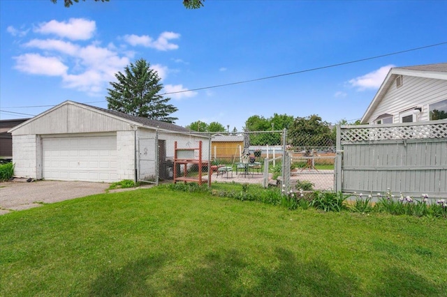 3732 6th St, Superior, WI 54880 - view of yard featuring a detached garage and a gate