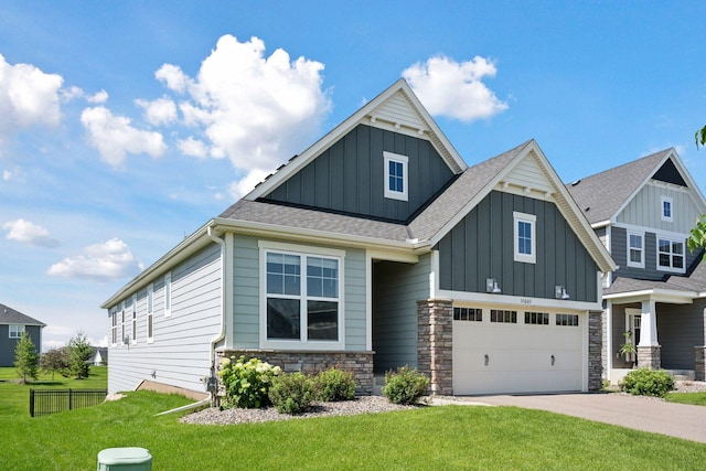 14660 109th Ave N, Maple Grove, MN 55369 - craftsman-style house featuring board and batten siding, driveway, an attached garage, stone siding, and a shingled roof