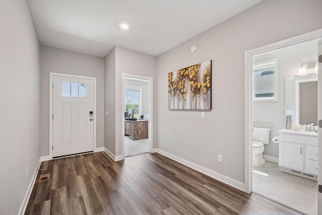 14660 109th Ave N, Maple Grove, MN 55369 - entrance foyer with wood finished floors and baseboards
