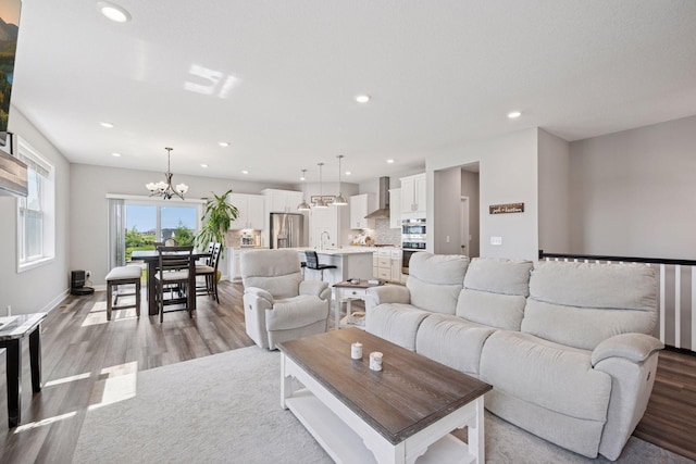 14660 109th Ave N, Maple Grove, MN 55369 - living room with light wood-style flooring, a chandelier, and recessed lighting